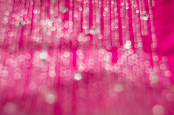 verschwommenes rosafarbenes Textil mit Strasses - Foto, Bild
