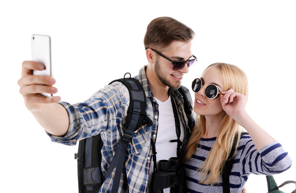 Pair of travelers making photo with phone camera isolated on white - Fotografie, Obrázek