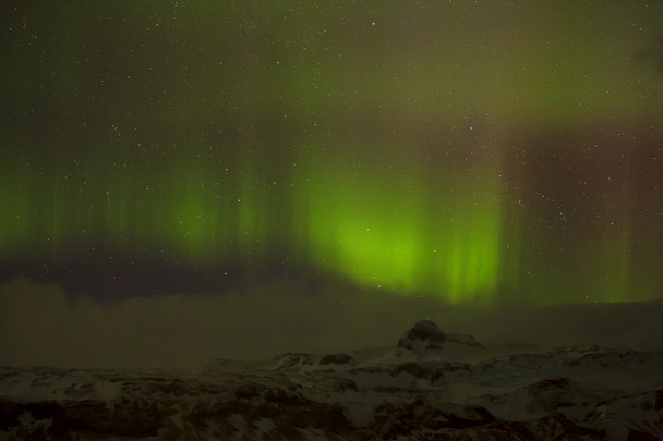 Различные цвета северного сияния в Исландии
 - Фото, изображение