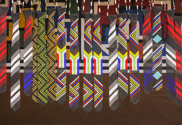 African unique traditional handmade colorful beads ties. Flag of South Africa. Local craft market. - Photo, Image