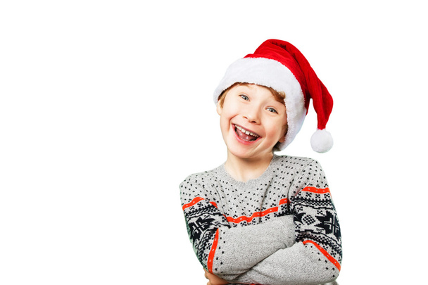 Portrait of a boy in christmas hat with happy and joyful facial expression - Zdjęcie, obraz