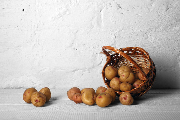 Scatter basket with potatoes - Photo, Image