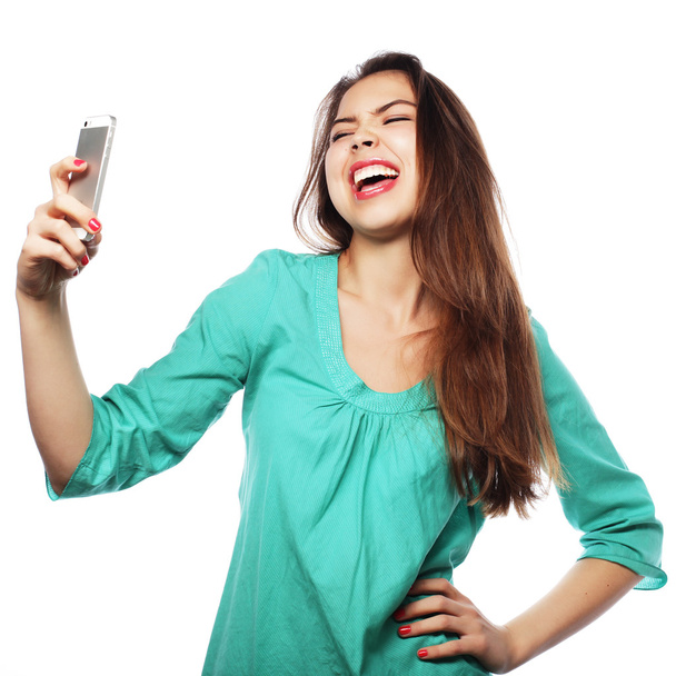 Pretty teen girl taking selfies - Fotó, kép