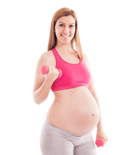 Smiling pregnant with dumbells - Φωτογραφία, εικόνα