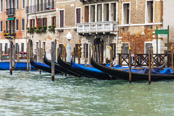 VENICE, ITALY - on MAY 3, 2015. City landscape early in the morning. Gondolas are moored at the coast of the Grand channel (Canal Grande). - 写真・画像