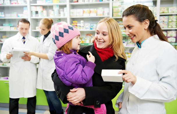 Pharmacy chemist, mother and child in drugstore - Foto, Imagem