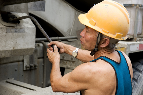 Hardworking laborer on construction site - Photo, Image
