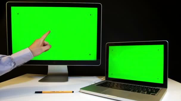 Man Working on the Laptop and Display with a Green Screen - Metraje, vídeo