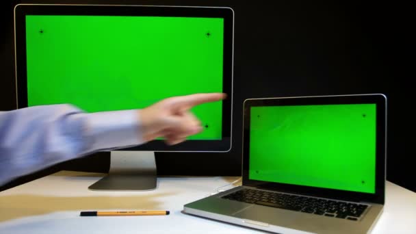 Man Working on the Laptop and Display with a Green Screen - Imágenes, Vídeo
