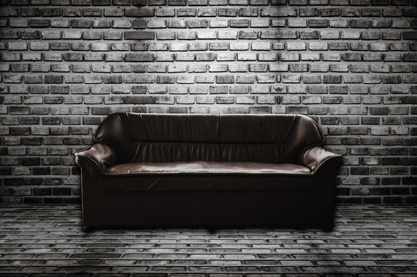 leather sofa in brick room - Foto, imagen