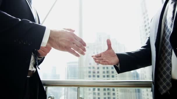 businessmen shaking hands after deal - Footage, Video