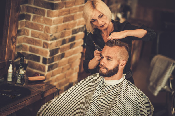Client visiting hairstylist in barber shop - Photo, Image