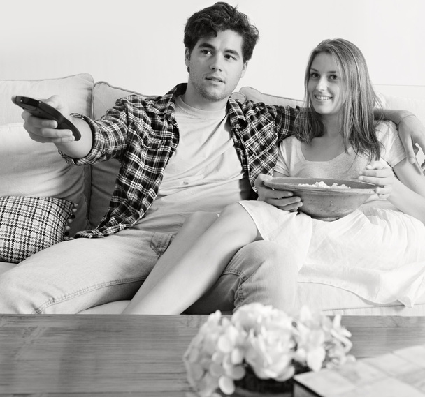 Couple watching television, eating pop corn - Fotoğraf, Görsel