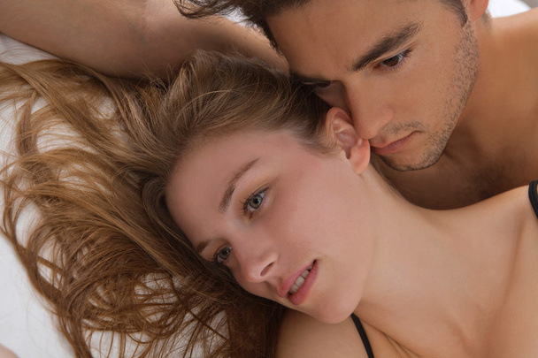 Attractive young couple in bed - Photo, Image