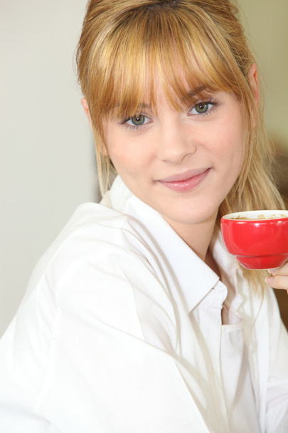 Young woman drinking coffee at home - Fotografie, Obrázek