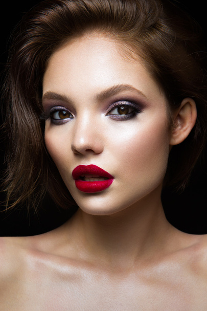 Beautiful young model with red lips - Fotó, kép