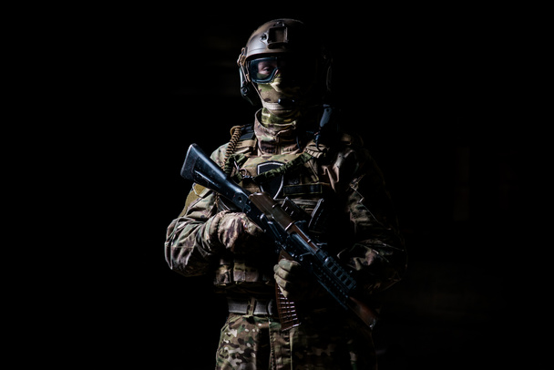 Military man in a mask and with a submachine gun - Photo, Image