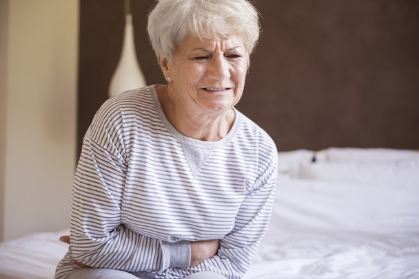 mature woman with stomachache - Photo, image