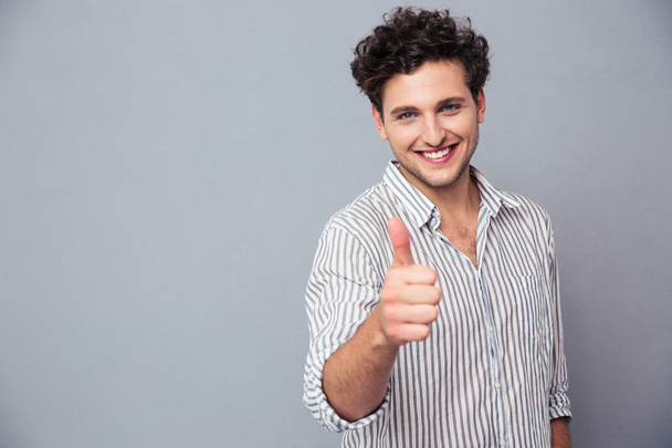 Happy man showing thumb up  - Фото, изображение