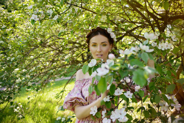 Young beautiful woman in the garden - Fotografie, Obrázek