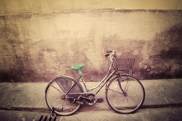 old bicycle in a rustic street in Florence - Photo, Image