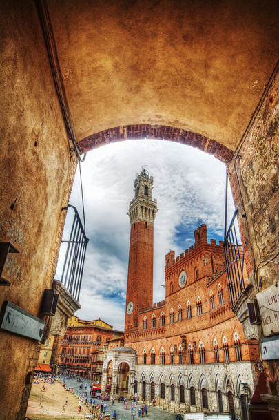 Piazza del Campo in Siena seen from an arch - Photo, Image