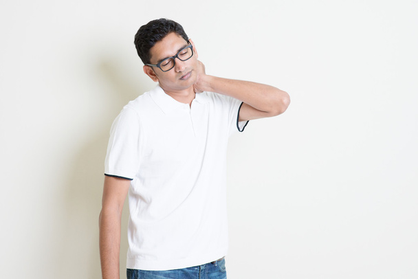 Indian guy with neck pain - 写真・画像