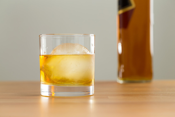 Glass and bottle of whiskey - Fotó, kép