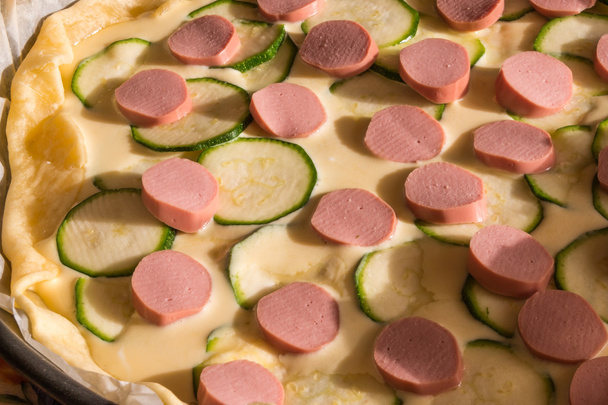 raw wurstel and zucchini savoury pie, puff - Photo, Image