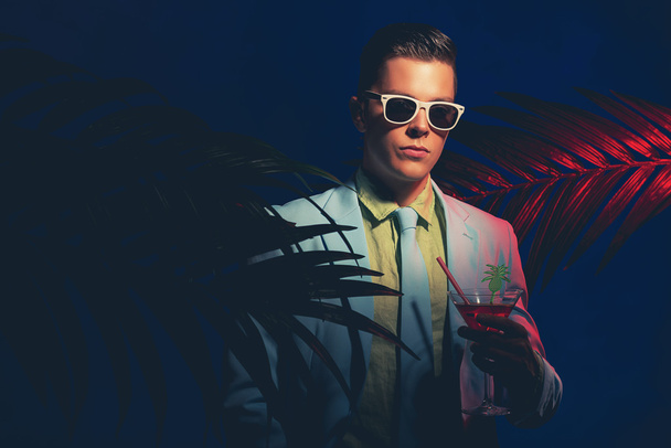 Young Man Holding Cocktail Drink - 写真・画像