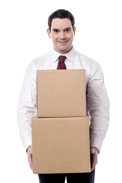 Corporate man carrying a cardboard boxes - Foto, Imagem