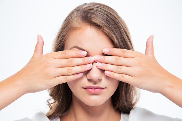 Young woman covering her eyes  - Photo, image
