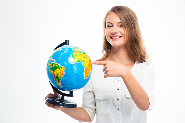 Happy girl pointing finger on globe - Фото, изображение