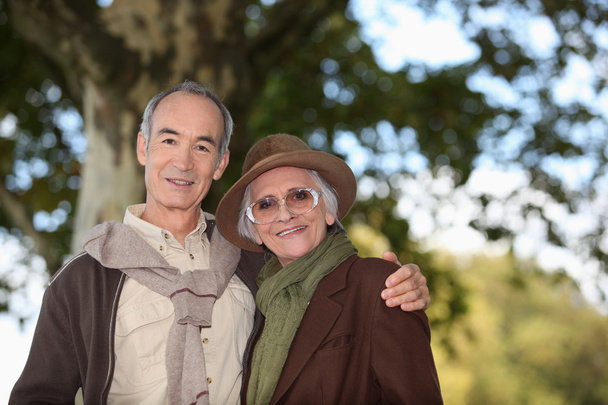 Elderly couple taking a walk together in the forest - Photo, Image
