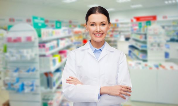young woman pharmacist drugstore or pharmacy - Фото, изображение
