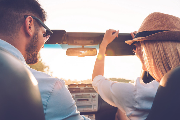 couple having fun while riding in convertible - Photo, image