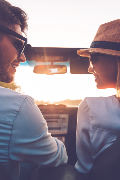 couple looking at each other in convertible - Photo, Image