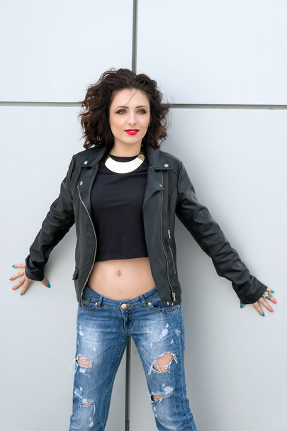 Glamorous young brunette woman in black leather jacket having fun in the city. - Foto, Imagem