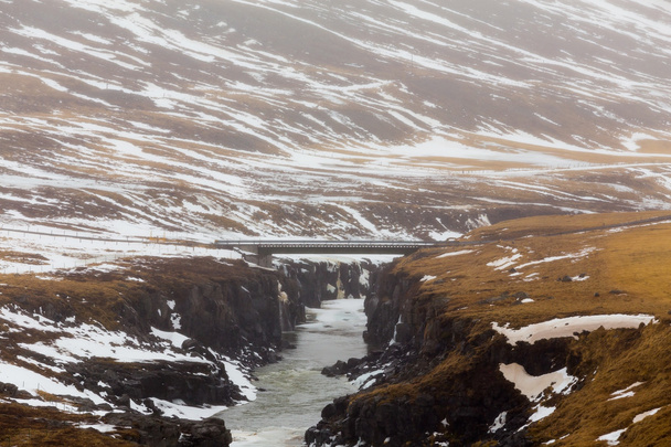 Snow mountain and waterfalls during late winter - Фото, зображення