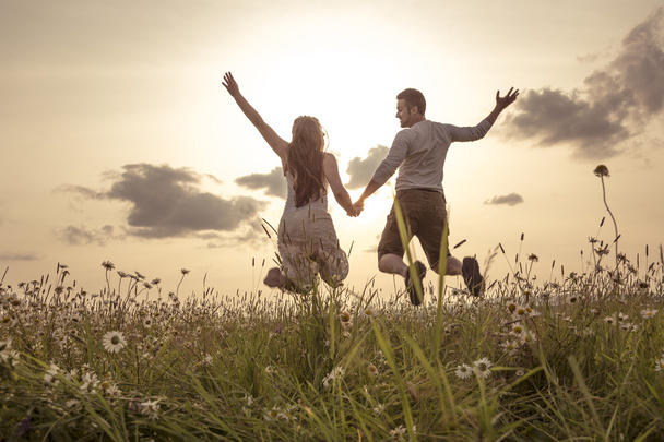 Young couple in love outdoor at the sunset - Foto, imagen