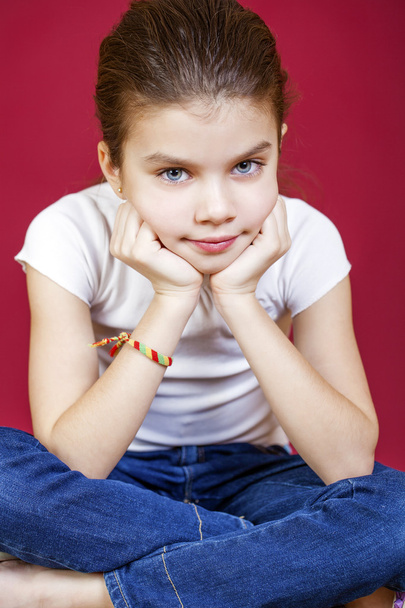 Portrait of a charming brunette little girl looking at camera - Foto, Imagem