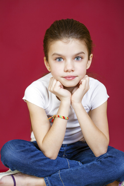 Portrait of a charming brunette little girl looking at camera - Фото, изображение