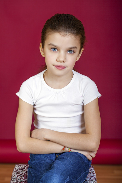 Portrait of a charming blonde little girl looking at camera - Foto, imagen