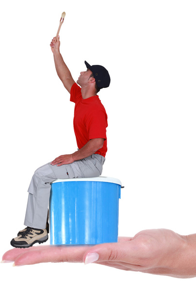 Painter on blue paint can - Photo, Image