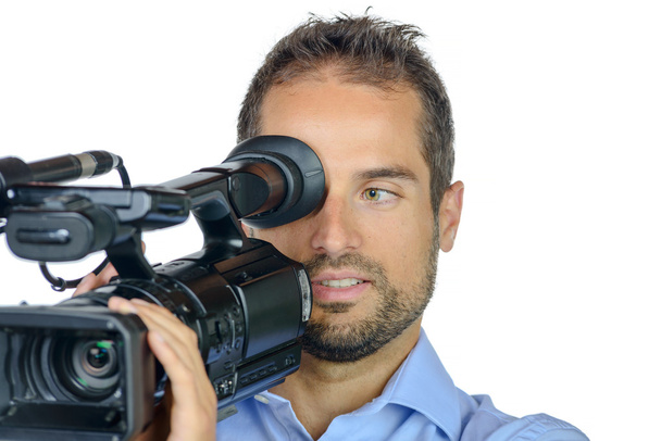 ein junger Mann mit professioneller Filmkamera - Foto, Bild