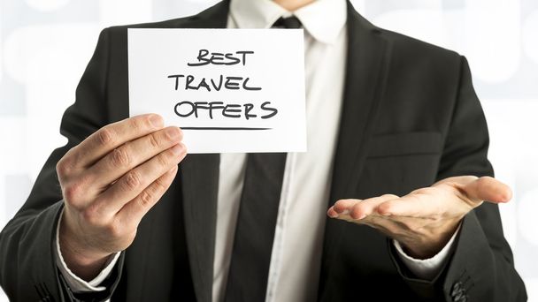 Businessman with Best Travel Offers Texts on Paper - Zdjęcie, obraz