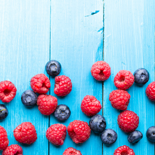 Summer berries on wooden background - Valokuva, kuva