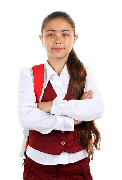 Beautiful little girl in school uniform isolated on white - 写真・画像