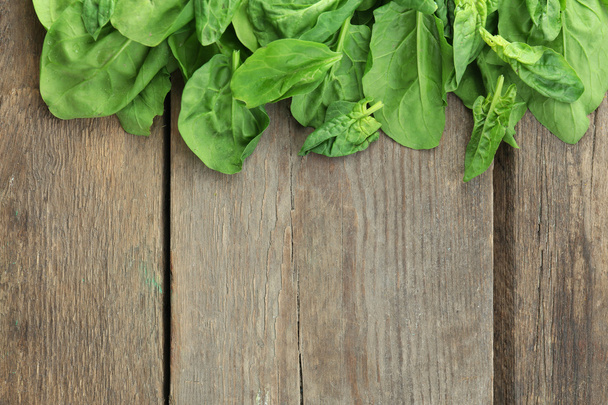 Frame of fresh spinach leaves on wooden background - Fotografie, Obrázek