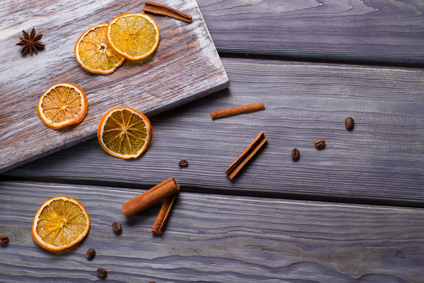 Dried orange with cinnamon sticks. - Foto, Bild